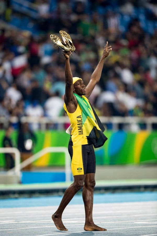 In goldenen Puma-Schuhen siegt Usain Bolt über 100 Meter – und setzt seinen Ausrüster anschließend gut in Szene.